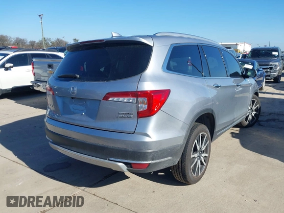 2020 Honda Pilot Touring 8-Passenger with VIN 5FNYF6H95LB021455, listed as a IAAI auction lot 41187609 with 35,589 mi miles and . Bid and sale history available at DreamBid. Image 4.