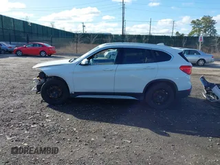 2018 BMW X1 xDrive28i with VIN WBXHT3C34J5L29714, listed as a IAAI auction lot 41825126 with 89,970 mi miles. Bid and sale history available at carsss.com. Image 14.