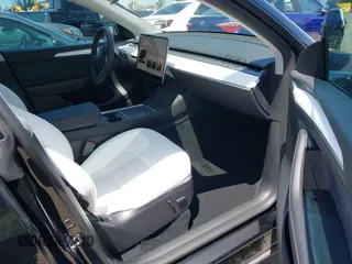 2024 Tesla Model Y with VIN 7SAYGDED9RF191453, listed as a IAAI auction lot 42272051 with 7,805 mi miles and . Bid and sale history available at DreamBid. Image 5.