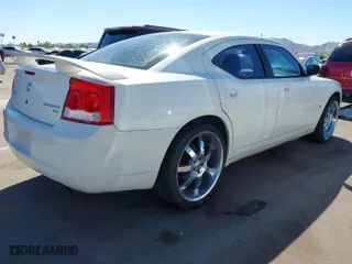 2009 Dodge Charger SXT with VIN 2B3KA33V99H515295, listed as a IAAI auction lot 41879006 with 207230 miles. Bid and sale history available at carsss.com. Image 4.