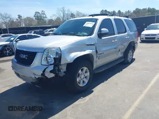 2014 GMC Yukon SLT with VIN 1GKS1CE04ER121301, listed as a IAAI auction lot 41825056 with 141,562 mi miles. Bid and sale history available at carsss.com. Image 2.