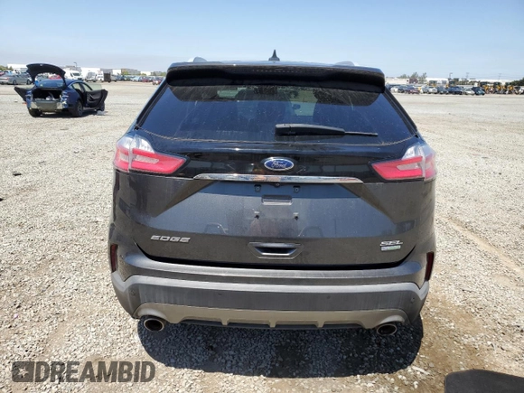 2020 Ford Edge SEL с VIN 2FMPK3J97LBA48892, выставлен на аукционе Copart как лот 58008145 с пробегом 52 588 миль миль и Списание • Salvage title. История ставок и продаж доступна на DreamBid. Изображение 6.