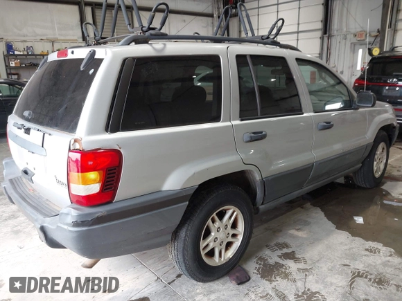 2004 Jeep Grand Cherokee Laredo with VIN 1J4GW48S44C161864, listed as a IAAI auction lot 42764536 with 143,833 mi miles and . Bid and sale history available at DreamBid. Image 4.