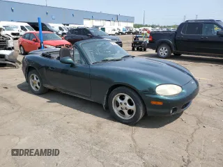 2000 Mazda MX-5 Miata with VIN JM1NB3533Y0151883, listed as a Copart auction lot 64423925 with 180,275 mi miles and Salvage title. Bid and sale history available at DreamBid. Image 4.