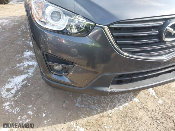 2016 Mazda CX-5 Touring with VIN JM3KE2CY6G0910986, listed as a IAAI auction lot 41619401 with NaN miles. Bid and sale history available at carsss.com. Image 6.