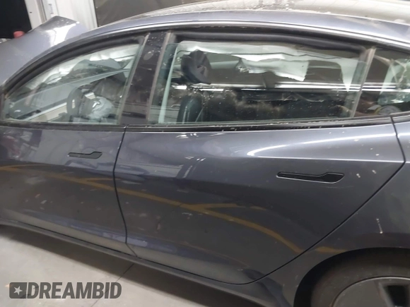 2023 Tesla Model 3 with VIN 5YJ3E1EAXPF669538, listed as a IAAI auction lot 40329679 with 16,612 mi miles and . Bid and sale history available at DreamBid. Image 13.