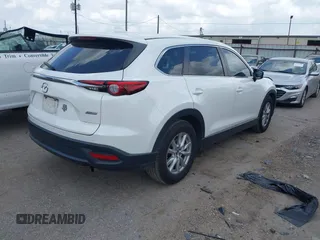 2016 Mazda CX-9 Sport z VIN JM3TCABY1G0111316, wystawiony jako IAAI lot #42085945 z przebiegiem 98 691 mil mil oraz . Historia ofert i sprzedaży dostępna na DreamBid. Obrazek 4.