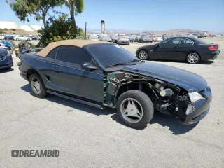 1998 Ford Mustang with VIN 1FAFP4447WF156297, listed as a Copart auction lot 60757265 with 61,296 mi miles and Salvage title. Bid and sale history available at DreamBid. Image 4.