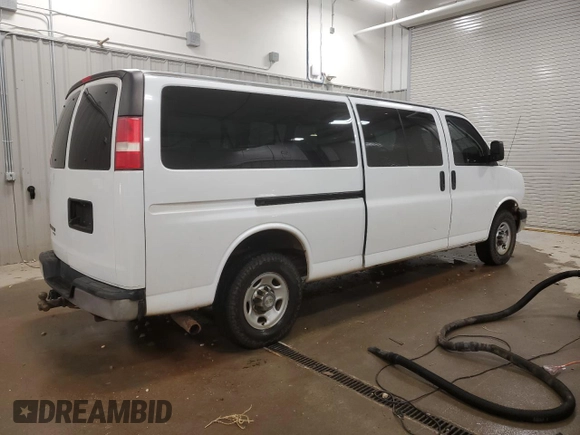 2014 Chevrolet Express Passenger LT with VIN 1GAZG1FG4E1176590, listed as a Copart auction lot 83660024 with 167,653 mi miles and Salvage title. Bid and sale history available at DreamBid. Image 3.