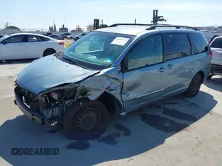 2010 Toyota Sienna CE with VIN 5TDKK4CCXAS332266, listed as a IAAI auction lot 41809577 with 217,051 mi miles. Bid and sale history available at carsss.com. Image 2.