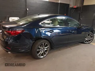 2017 Mazda 6 Grand Touring with VIN JM1GL1W51H1101519, listed as a IAAI auction lot 42132215 with 145,796 mi miles. Bid and sale history available at carsss.com. Image 6.