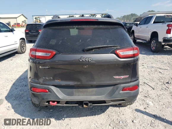 2014 Jeep Cherokee Trailhawk with VIN 1C4PJMBS1EW304718, listed as a Copart auction lot 64105485 with 151,315 mi miles and Salvage title. Bid and sale history available at DreamBid. Image 6.