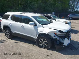 2021 GMC Acadia SLE with VIN 1GKKNRLS2MZ144117, listed as a IAAI auction lot 42231052 with 26,614 mi miles and . Bid and sale history available at DreamBid. Image 1.