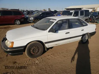 1987 Ford Taurus z VIN 1FABP50U4HG223140, wystawiony jako Copart lot #76193014 z przebiegiem 7 795 mil mil oraz Czysty tytuł • Clean title. Historia ofert i sprzedaży dostępna na DreamBid. Obrazek 1.