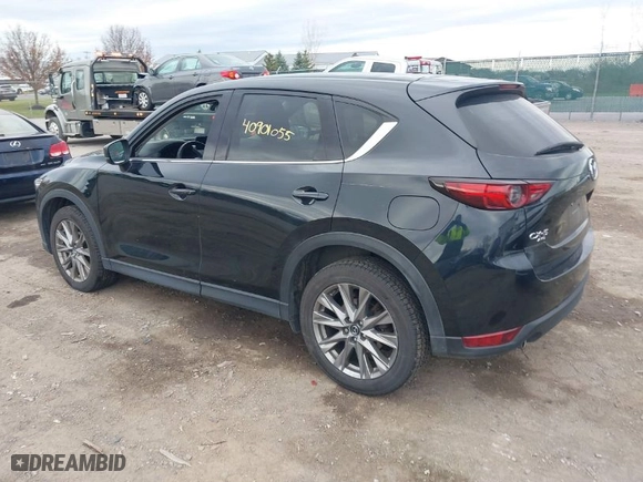 2021 Mazda CX-5 Grand Touring with VIN JM3KFBDMXM0456939, listed as a IAAI auction lot 40901055 with 113,540 mi miles. Bid and sale history available at carsss.com. Image 3.