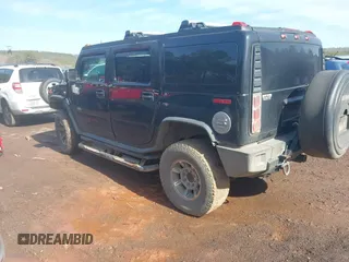 2003 Hummer H2 with VIN 5GRGN23U33H144379, listed as a IAAI auction lot 41452982 with 227,746 mi miles. Bid and sale history available at carsss.com. Image 3.