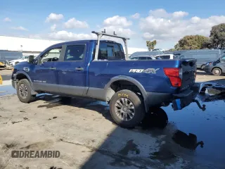 2016 Nissan Titan XD PRO-4X with VIN 1N6BA1F42GN509751, listed as a Copart auction lot 80576664 with 79,037 mi miles and Salvage Title. Bid and sale history available at carsss.com. Image 2.