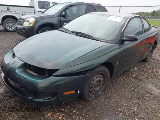 1997 Saturn SC z VIN 1G8ZG1277VZ342397, wystawiony jako IAAI lot #41966570 z przebiegiem 184 054 mil mil oraz . Historia ofert i sprzedaży dostępna na DreamBid. Obrazek 2.