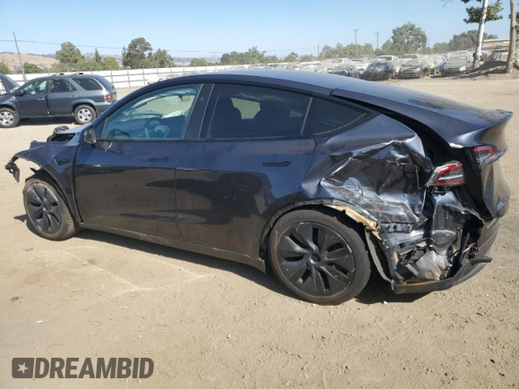 2024 Tesla Model Y with VIN 7SAYGDED0RF125308, listed as a Copart auction lot 61614675 with 11,608 mi miles and Salvage title. Bid and sale history available at DreamBid. Image 2.