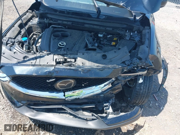 2020 Mazda CX-5 Grand Touring with VIN JM3KFADM9L1837183, listed as a IAAI auction lot 42340628 with 81,975 mi miles and . Bid and sale history available at DreamBid. Image 6.