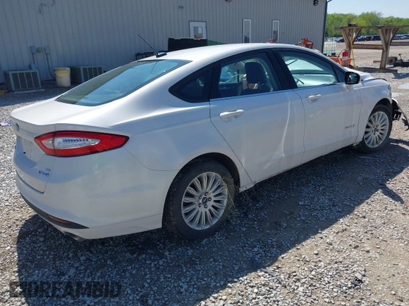 2013 Ford Fusion SE Hybrid z VIN 3FA6P0LU9DR349321, wystawiony jako IAAI lot #42156321 z przebiegiem 90 688 mil mil oraz . Historia ofert i sprzedaży dostępna na DreamBid. Obrazek 4.