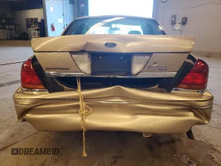 2000 Ford Crown Victoria LX z VIN 2FAFP74WXYX116130, wystawiony jako Copart lot #79441204 z przebiegiem 128 133 mil mil oraz Szkoda całkowita • Salvage title. Historia ofert i sprzedaży dostępna na DreamBid. Obrazek 6.