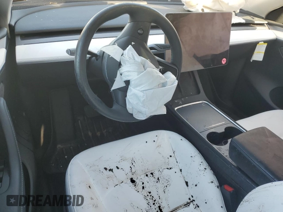 2023 Tesla Model Y Long Range z VIN 7SAYGAEE1PF810888, wystawiony jako Copart lot #88991735 z przebiegiem Nie podano mil oraz Nie do naprawy • Non repairable. Historia ofert i sprzedaży dostępna na DreamBid. Obrazek 8.