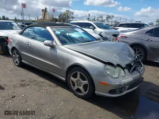 2005 Mercedes-Benz CLK-Class 5.0L with VIN WDBTK75J45F125457, listed as a IAAI auction lot 41586377 with 115,188 mi miles. Bid and sale history available at carsss.com. Image 1.