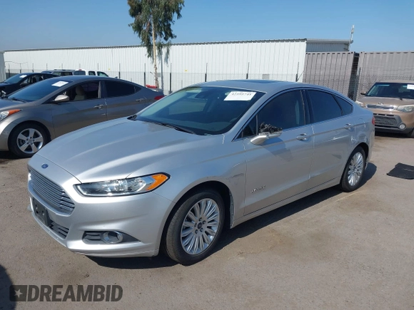 2016 Ford Fusion SE Hybrid z VIN 3FA6P0LU8GR203934, wystawiony jako IAAI lot #42595741 z przebiegiem 84 189 mil mil oraz . Historia ofert i sprzedaży dostępna na DreamBid. Obrazek 18.