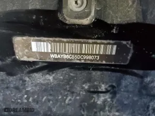 2013 BMW 7 Series 750i xDrive with VIN WBAYB6C55DC998073, listed as a Copart auction lot 67552004 with 0 mi miles and Salvage Title. Bid and sale history available at carsss.com. Image 12.