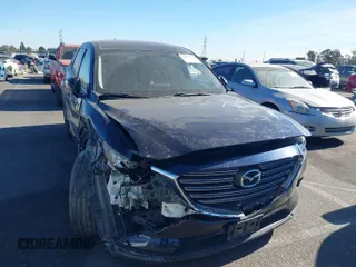 2016 Mazda CX-9 Touring with VIN JM3TCACY1G0102100, listed as a IAAI auction lot 41383584 with 174,501 mi miles and . Bid and sale history available at carsss.com. Image 1.