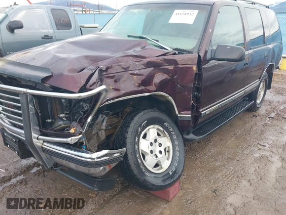 1997 GMC Yukon with VIN 1GKEK13R0VJ755574, listed as a IAAI auction lot 41158932 with 212,668 mi miles. Bid and sale history available at carsss.com. Image 6.