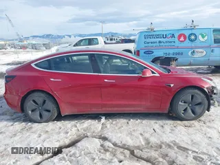 2018 Tesla Model 3 Long Range Battery with VIN 5YJ3E1EB0JF064041, listed as a IAAI auction lot 41562239 with 54,720 mi miles and . Bid and sale history available at DreamBid. Image 14.