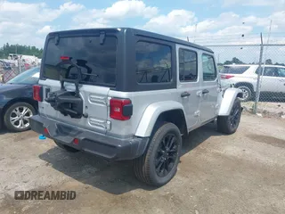 2023 Jeep Wrangler Sahara with VIN 1C4JJXP69PW695915, listed as a IAAI auction lot 42662028 with 36,957 mi miles and . Bid and sale history available at DreamBid. Image 4.