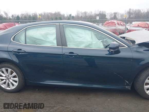 2020 Toyota Camry LE with VIN 4T1L11AK3LU977805, listed as a IAAI auction lot 41907558 with 82,237 mi miles and . Bid and sale history available at DreamBid. Image 14.