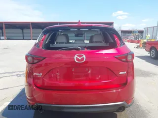 2018 Mazda CX-5 Grand Touring with VIN JM3KFBDM6J0424663, listed as a IAAI auction lot 42003207 with 95,442 mi miles and . Bid and sale history available at DreamBid. Image 6.