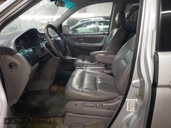 2004 Honda Odyssey EX-L with VIN 5FNRL189X4B098131, listed as a Copart auction lot 47294865 with 196,581 mi miles and Salvage Title. Bid and sale history available at DreamBid. Image 7.