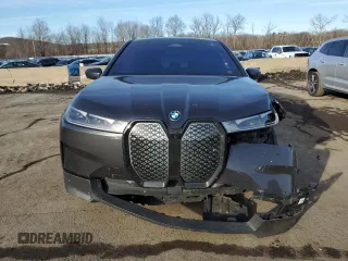 2024 BMW iX xDrive50 z VIN WB523CF02RCP06595, wystawiony jako Copart lot #44179575 z przebiegiem Nie podano mil oraz Szkoda całkowita • Salvage title. Historia ofert i sprzedaży dostępna na DreamBid. Obrazek 5.