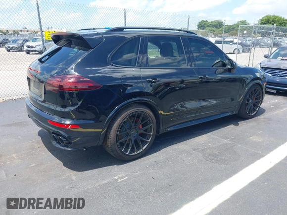 2016 Porsche Cayenne GTS z VIN WP1AD2A25GLA70430, wystawiony jako IAAI lot #42547008 z przebiegiem 108 374 mil mil oraz . Historia ofert i sprzedaży dostępna na DreamBid. Obrazek 4.