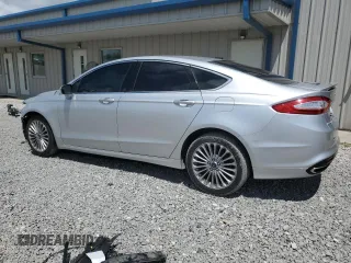 2016 Ford Fusion Titanium z VIN 3FA6P0D94GR181179, wystawiony jako Copart lot #56987005 z przebiegiem 79 841 mil mil oraz Czysty tytuł • Clean title. Historia ofert i sprzedaży dostępna na DreamBid. Obrazek 2.