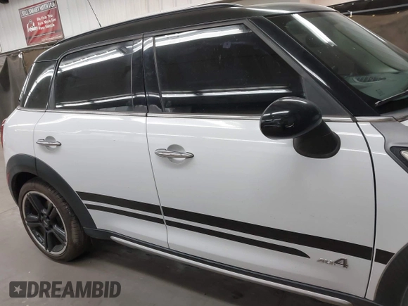 2015 MINI Countryman S with VIN WMWZC5C53FWT37722, listed as a IAAI auction lot 42151891 with 110,488 mi miles and . Bid and sale history available at DreamBid. Image 13.