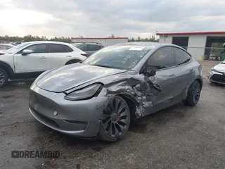 2024 Tesla Model Y Performance with VIN 7SAYGDEF3RA307468, listed as a IAAI auction lot 41805853 with 10,377 mi miles and . Bid and sale history available at DreamBid. Image 2.