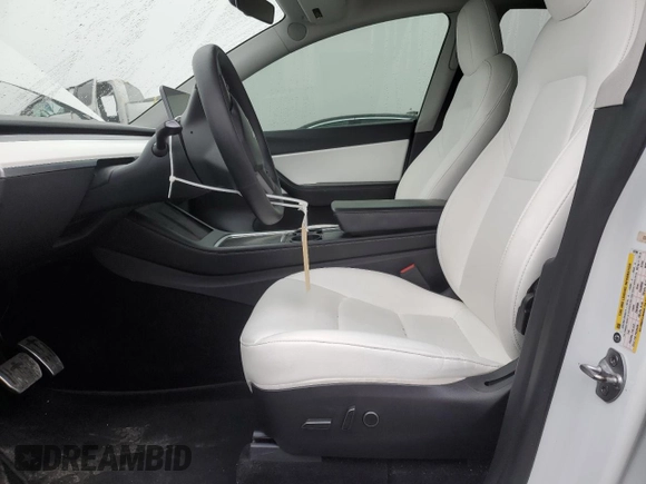 2021 Tesla Model Y Long Range with VIN 5YJYGDEE1MF267004, listed as a Copart auction lot 88708485 with 65,669 mi miles and Salvage Title. Bid and sale history available at DreamBid. Image 7.