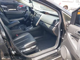 2010 Mazda CX-7 Touring z VIN JM3ER2W30A0341657, wystawiony jako IAAI lot #42123453 z przebiegiem 173 135 mil mil oraz . Historia ofert i sprzedaży dostępna na DreamBid. Obrazek 5.