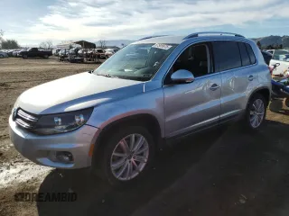 2012 Volkswagen Tiguan S with VIN WVGAV7AX4CW588783, listed as a Copart auction lot 87509975 with 115,790 mi miles and Salvage title. Bid and sale history available at DreamBid. Image 1.
