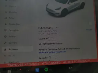 2022 Tesla Model Y Long Range with VIN 7SAYGDEE1NF559238, listed as a Copart auction lot 86744664 with 59,074 mi miles and Salvage Title. Bid and sale history available at carsss.com. Image 9.