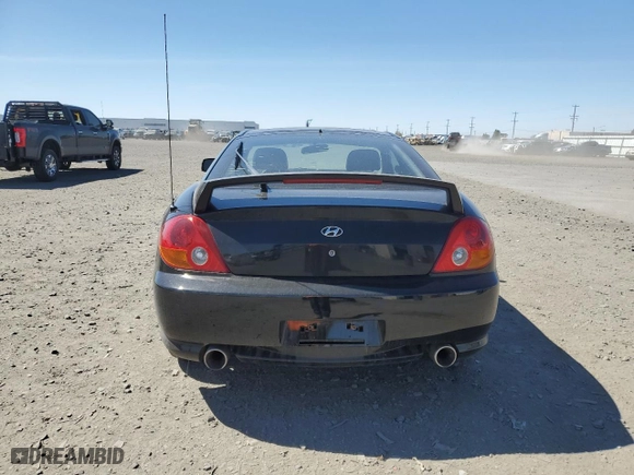 2004 Hyundai Tiburon GT with VIN KMHHN65F94U113699, listed as a Copart auction lot 53858355 with 221,999 mi miles and Salvage Title. Bid and sale history available at carsss.com. Image 6.