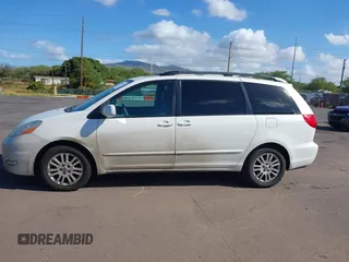 2010 Toyota Sienna XLE with VIN 5TDYK4CC3AS336590, listed as a IAAI auction lot 41798194 with 230,707 mi miles. Bid and sale history available at carsss.com. Image 14.