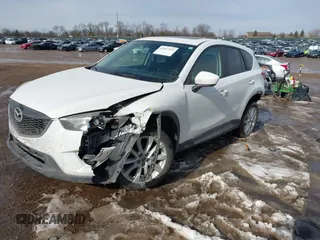 2014 Mazda CX-5 Grand Touring with VIN JM3KE4DY9E0300491, listed as a IAAI auction lot 41657153 with 157,394 mi miles and . Bid and sale history available at DreamBid. Image 17.