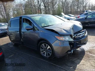 2015 Honda Odyssey Touring Elite z VIN 5FNRL5H9XFB067679, wystawiony jako IAAI lot #41913306 z przebiegiem 199 482 mil mil oraz . Historia ofert i sprzedaży dostępna na DreamBid. Obrazek 1.